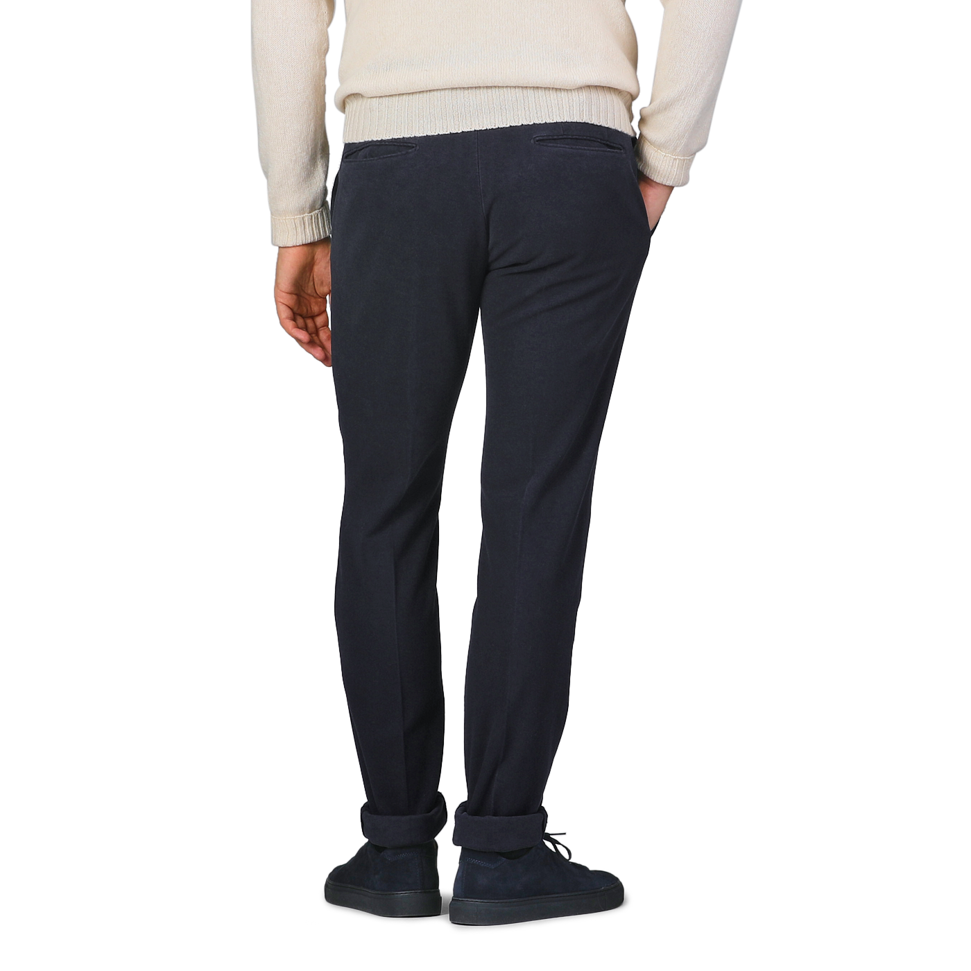 A person in a white sweater and Incotex Navy Blue Cotton Moleskin Model 30 Chinos stands facing away, with hands relaxed by their sides.