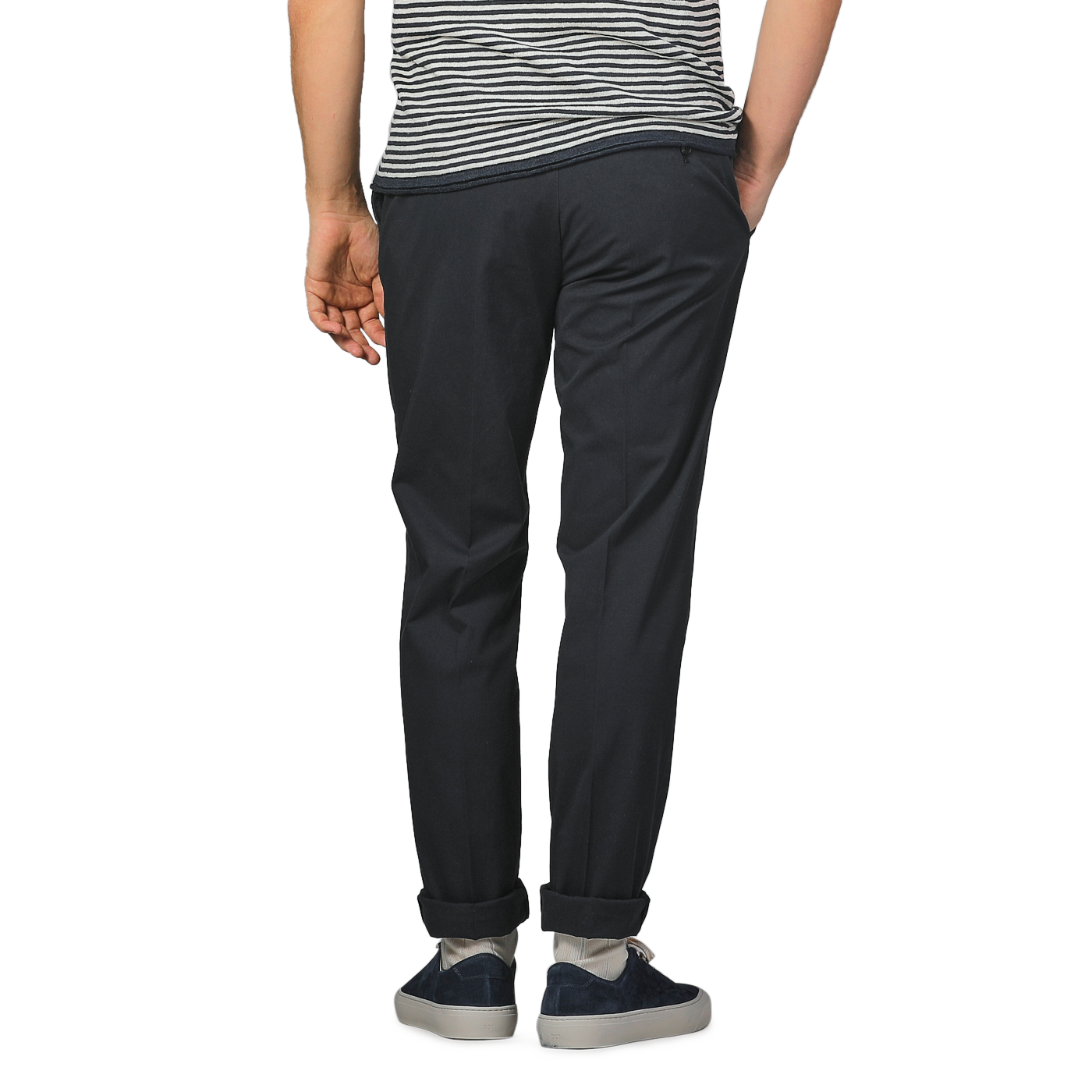 An individual in a striped shirt and Incotex's Navy Blue Cotton Royal Batavia Regular Chinos stands with hands in pockets, facing away.