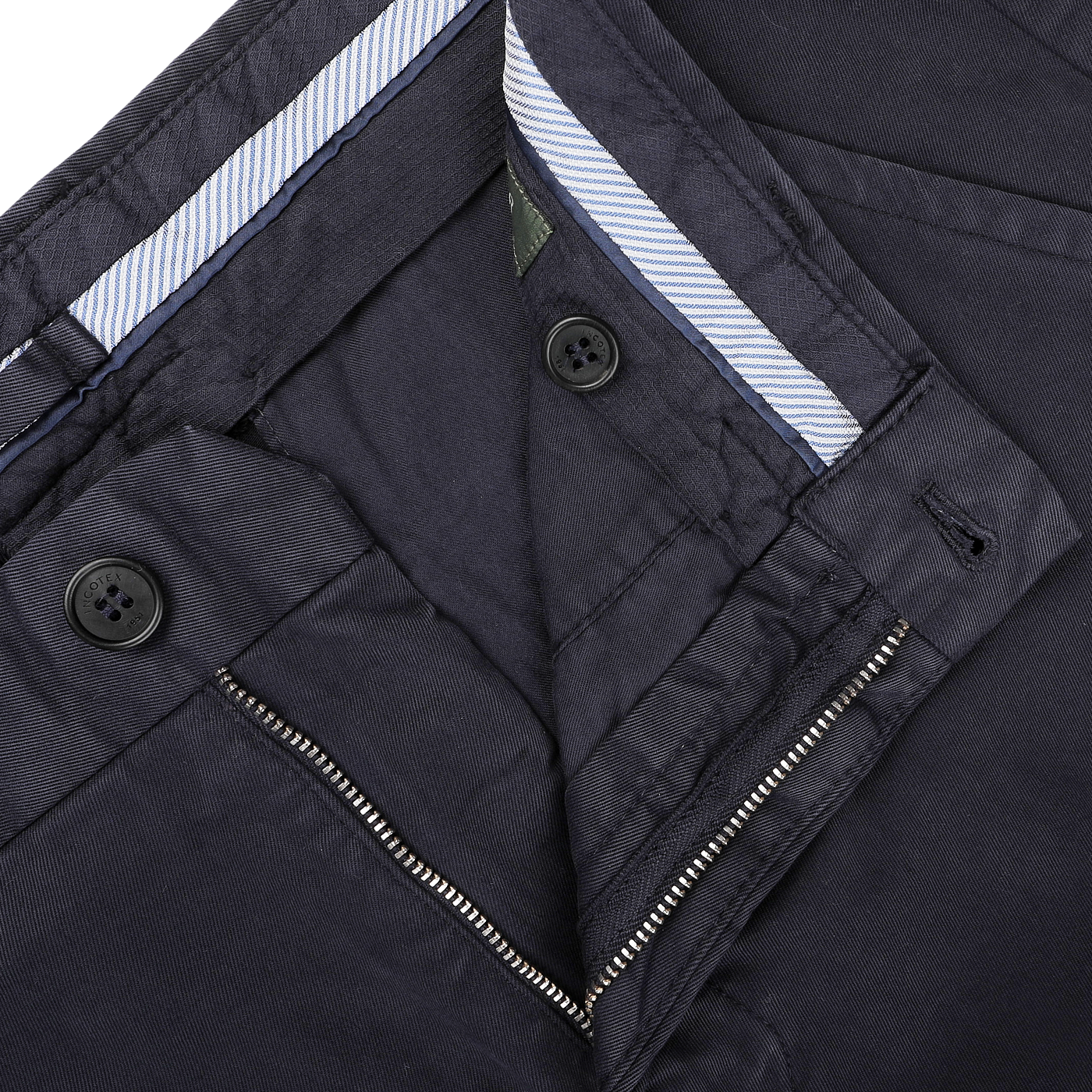 Close-up of an open pair of Navy Blue Cotton Stretch Model 8 Chinos by Incotex, displaying the inner waistband with striped fabric, along with zipper and button details.