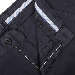 Close-up of an open pair of Navy Blue Cotton Stretch Model 8 Chinos by Incotex, displaying the inner waistband with striped fabric, along with zipper and button details.