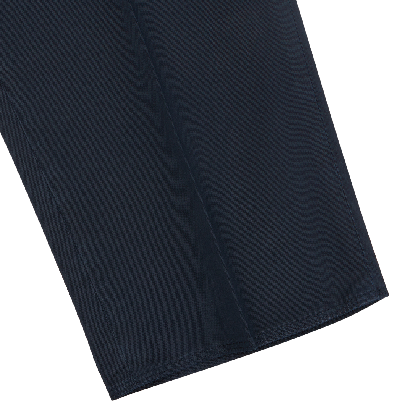 Close-up of Incotex navy blue cotton stretch regular fit chinos fabric, showing clean stitching and smooth texture on a light gray background.