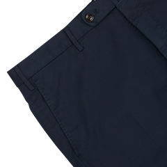 Close-up of Navy Blue Cotton Stretch Regular Chinos from Incotex with a button and belt loop on the waistband and a pleated design, showcasing a regular fit.