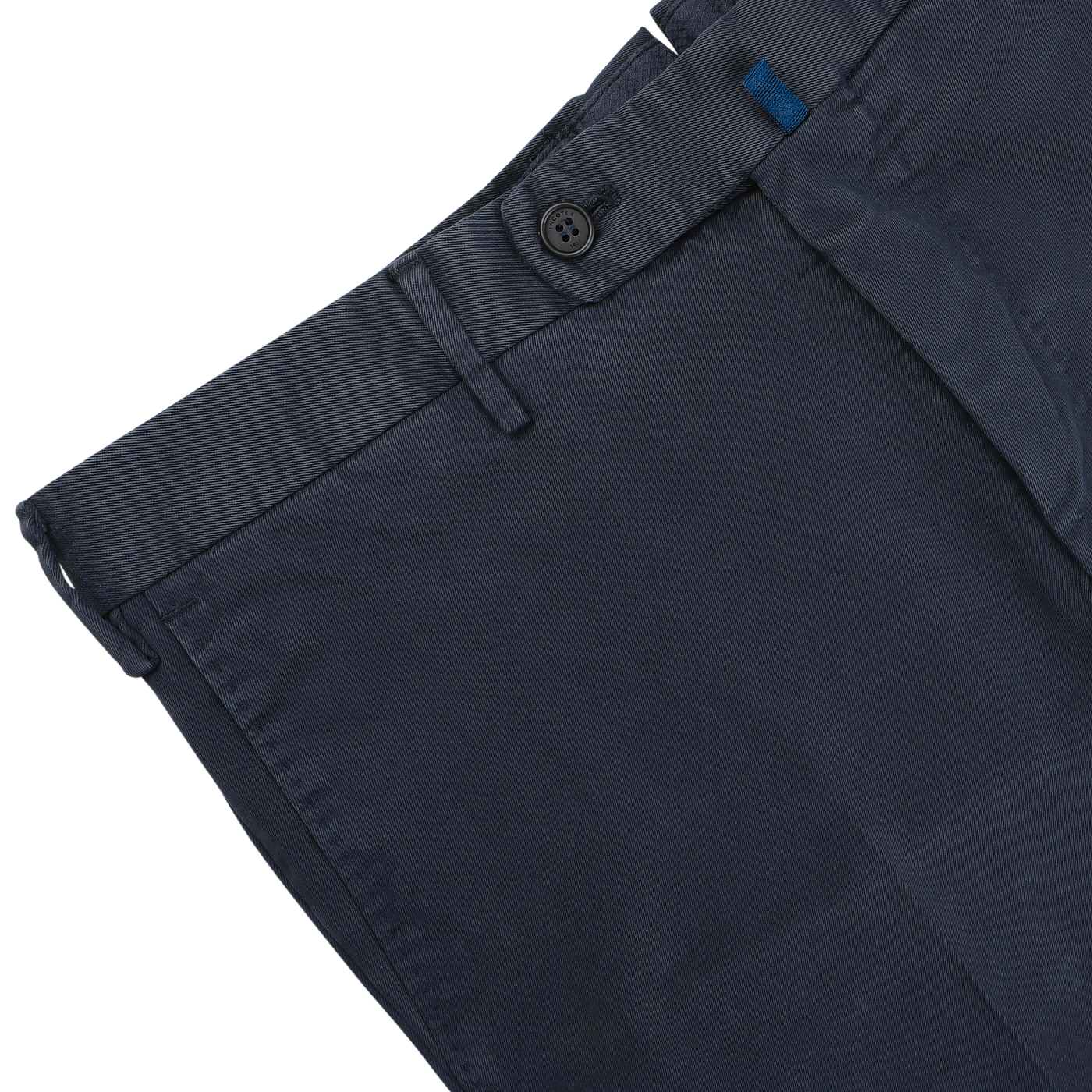 Close-up of Incotex's Navy Blue Cotton Twill Regular Chinos, showcasing button and belt loop details, set against a light gray background.