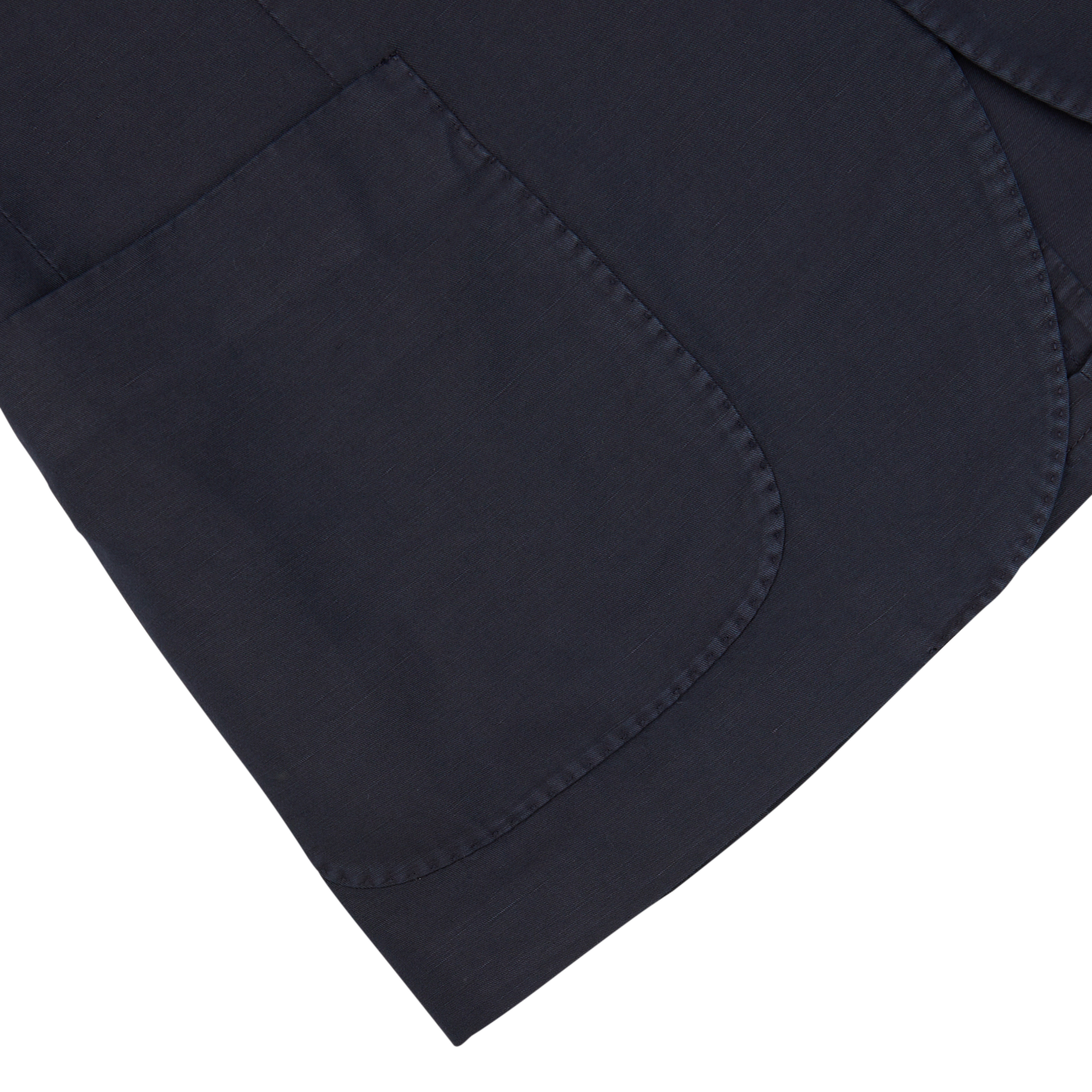 Navy blue Washed Chinolino suit fabric with reinforced stitched pocket corner on a white background by Slowear.