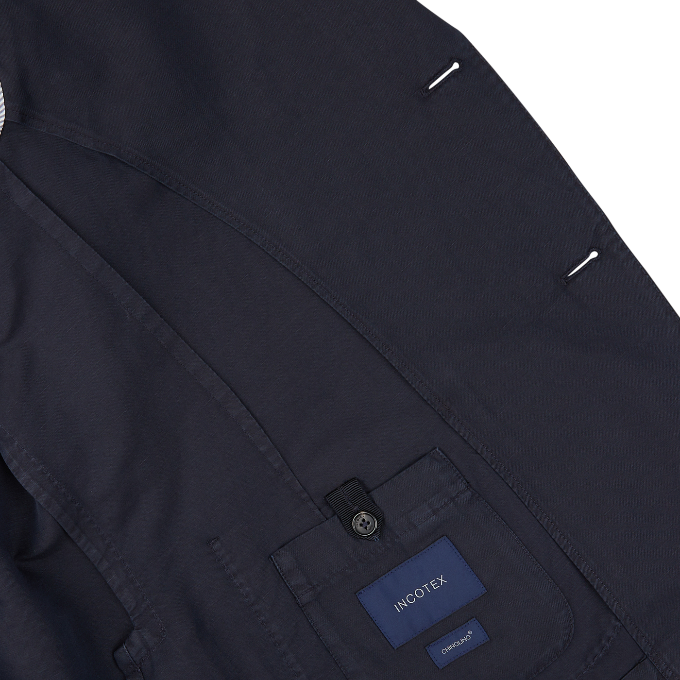 Close-up of a dark-colored regular fit Slowear navy blue washed Chinolino suit with visible pocket and brand label.