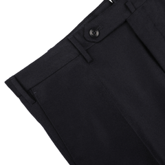 Close-up of the Incotex Navy Blue Wool Flannel Slim Trousers, emphasizing the sleek slim fit design, with a focus on the waistband, button, and part of a pocket against a plain background.