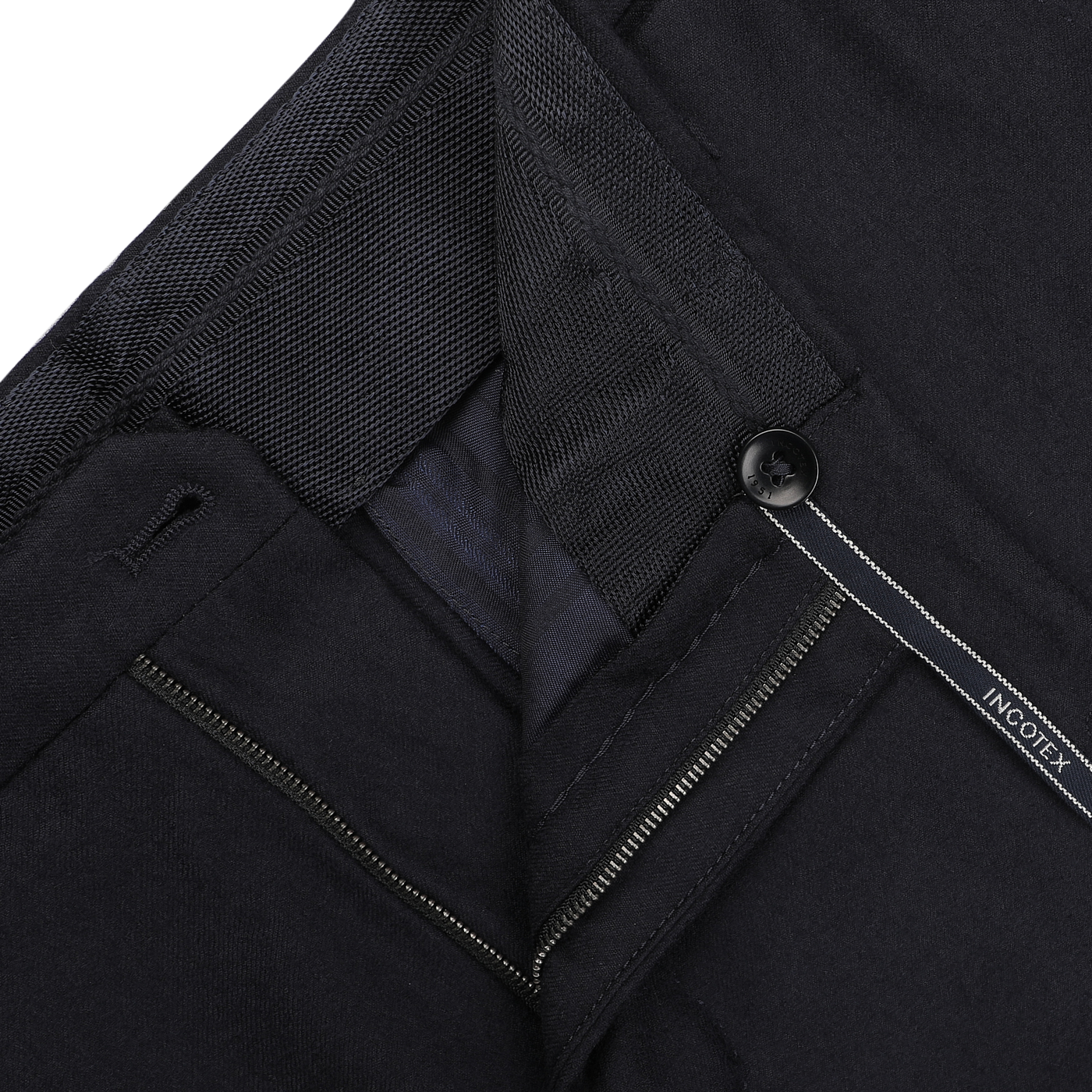 A close-up of the Navy Blue Wool Flannel Slim Trousers by Incotex, showcasing the visible zipper, button, and waistband detail.