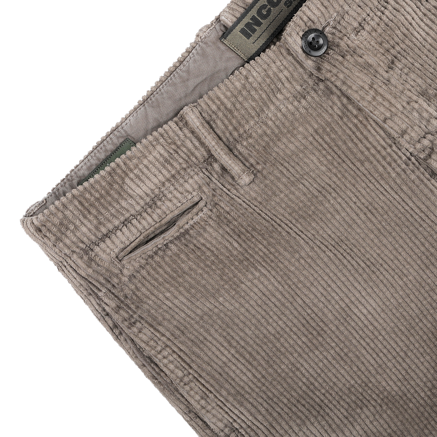 Close-up of the stone grey cotton corduroy trousers by Incotex, highlighting the waistband, a front pocket, and a button marked with "INCOTEX.