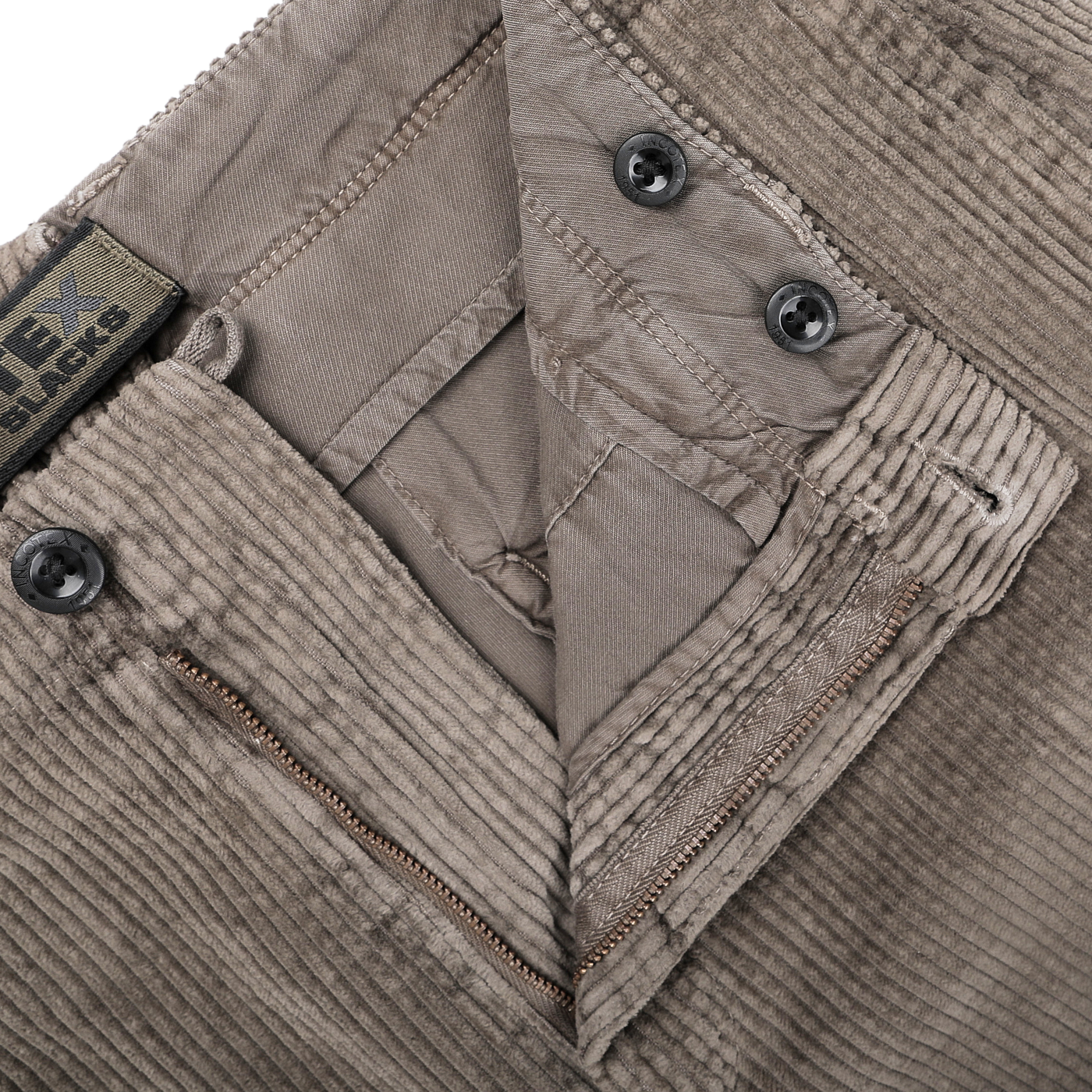 Close-up of Incotex's Stone Grey Cotton Corduroy Regular Fit Trousers, highlighting the waistband, brand label, buttons, and a closed zipper.