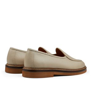 A pair of modern silhouette beige grained leather Lex loafers by Jacques Soloviére Paris.