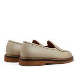 A pair of modern silhouette beige grained leather Lex loafers by Jacques Soloviére Paris.