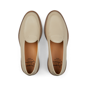 A pair of Beige Grained Leather Lex Loafers with brown soles from Jacques Soloviére Paris.