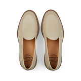 A pair of Beige Grained Leather Lex loafers by Jacques Soloviére Paris, with stitching details, displayed from a top-down perspective on a black background.