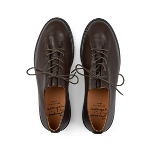 A pair of comfortable Ebano Grained Calf Leather Edouard Derbies with leather upper and laces, designed by Jacques Soloviere Paris.