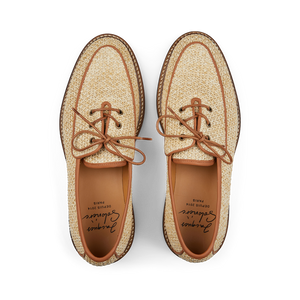 A pair of new Natural Beige Raffia Luco Derbies with brown soles and laces, designed by Jacques Soloviere Paris in Italy, displayed symmetrically on a black background.