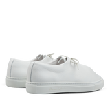 A pair of White Grained Leather Jim Sneakers, Jacques Soloviére Paris lace-up sneakers with a minimalist design on a transparent background.
