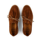 A pair of Tobacco Brown Suede Leather Ray Derbies from Jacques Soloviére Paris, with laces, viewed from above, against a black background.