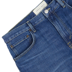 Close-up of Jeanerica's Medium Blue Washed Cotton TM005 Jeans with a focus on the front pocket and waistband.