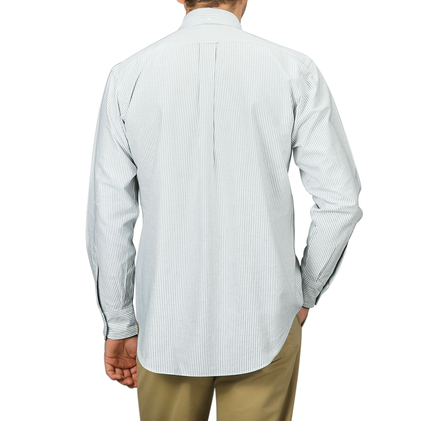 A person wearing a long-sleeved, green striped shirt from the Kamakura Shirts collection with tan pants, seen from the back. The washed cotton oxford fabric and button-down collar add a touch of classic elegance to the ensemble.