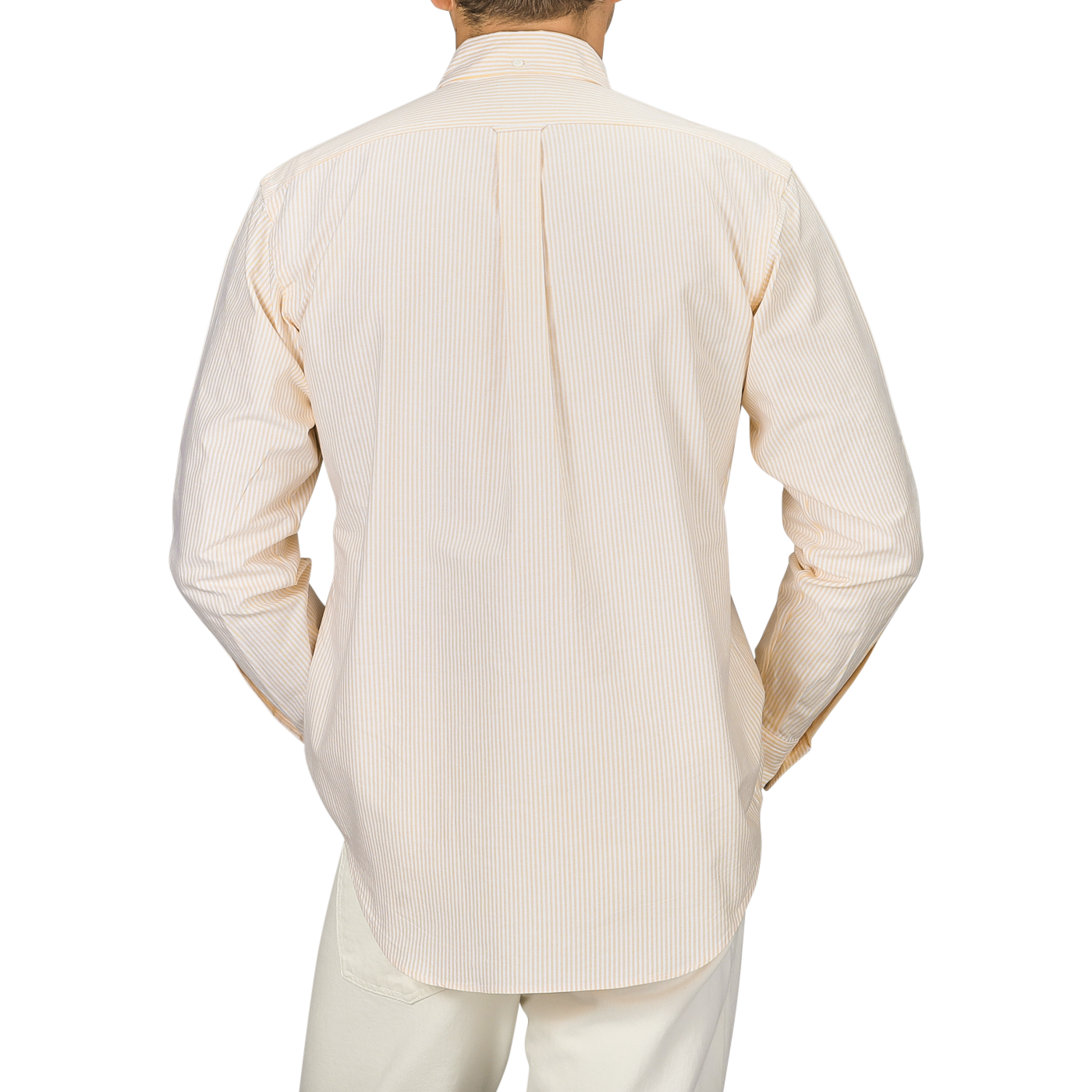 Back view of a person wearing the Yellow Striped Washed Cotton Oxford BD Shirt by Kamakura Shirts, paired with white pants, standing against a neutral background.