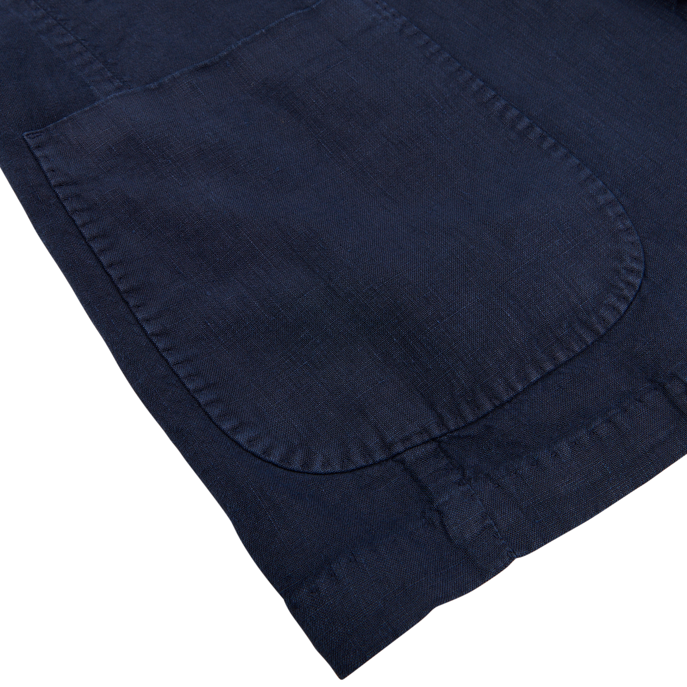 Close-up view of a L.B.M. 1911 navy blue washed linen suit with detailed stitching.