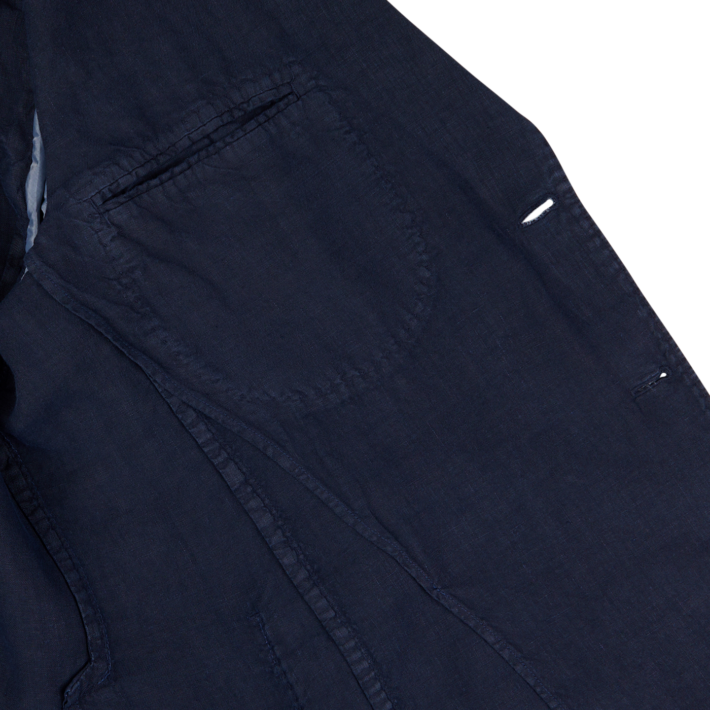Close-up view of an L.B.M. 1911 navy blue washed linen suit with detailed stitching around the pocket area on a white background.
