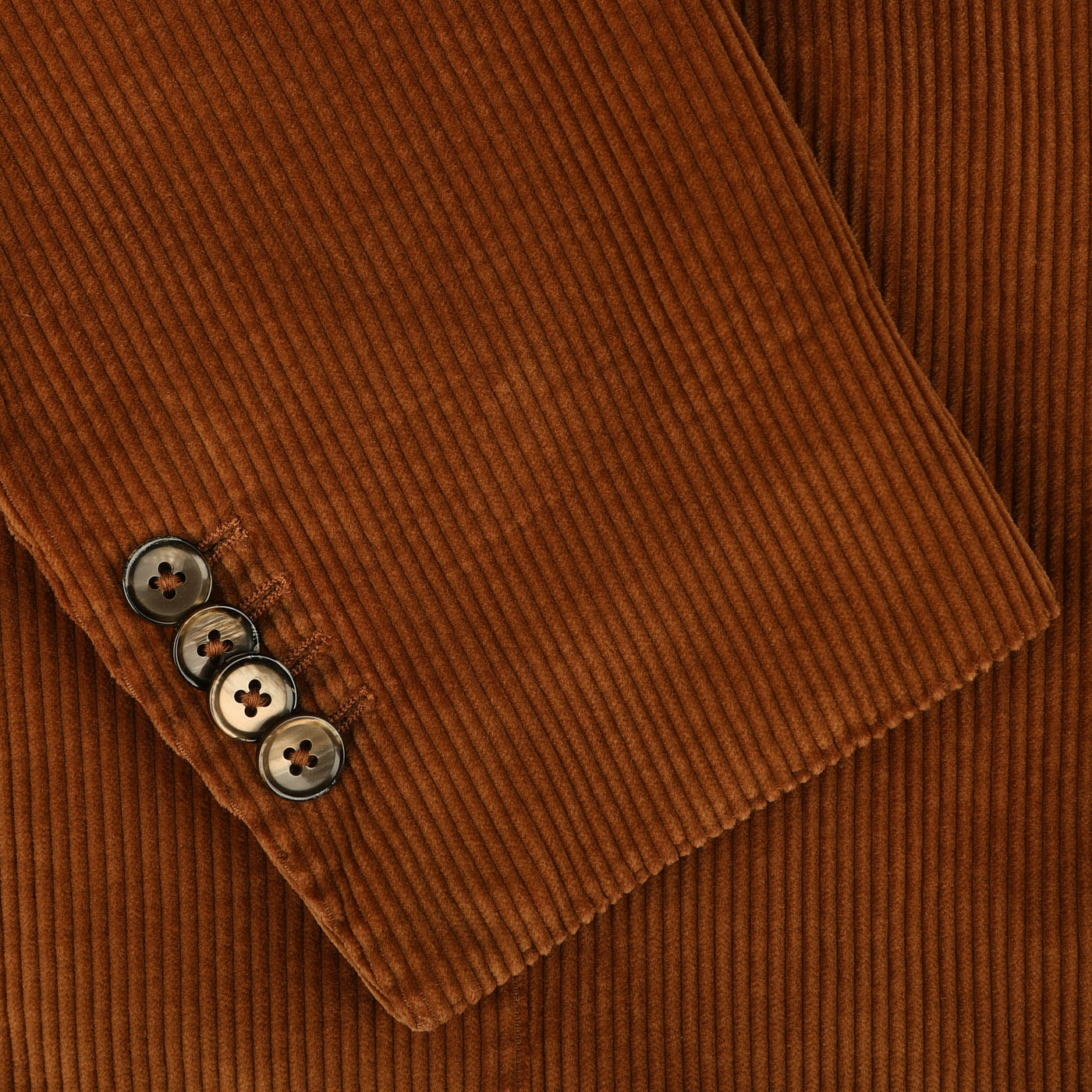 Close-up of an L.B.M. 1911 Cinnamon Brown Cotton Corduroy Blazer, showcasing the slim fit sleeve with four matching buttons crafted from pure cotton corduroy fabric.