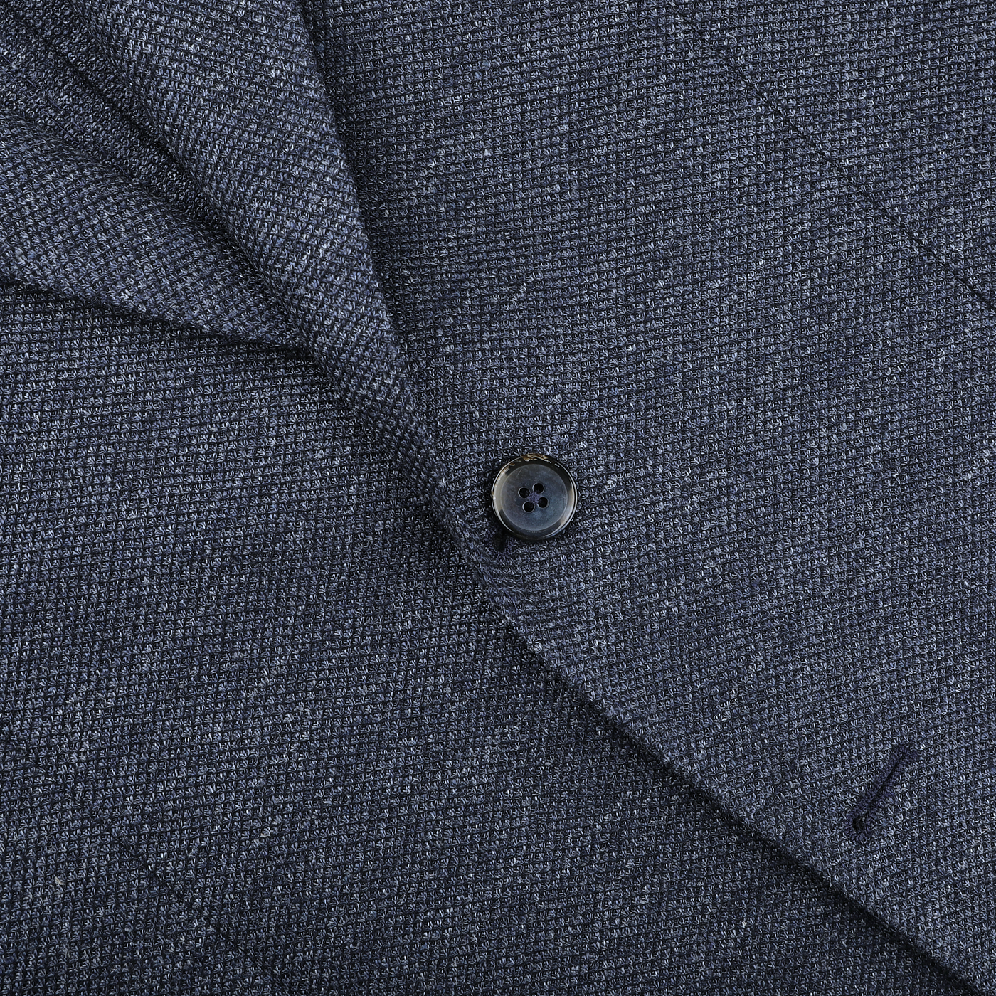 Close-up of the Dark Blue Linen Cotton Jersey Blazer by L.B.M. 1911, highlighting Italian tailoring with textured fabric, a single black button, and a visible lapel buttonhole.