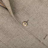 Close-up view of an Oatmel Beige Shetland Wool Cashmere Blazer by L.B.M. 1911, showcasing its slim fit and single beige button fastened.