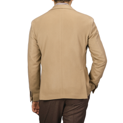 The back view shows an individual wearing the Camel Beige Brushed Wool Slim Blazer by L.B.M. 1911, paired with brown pants, against a gray background.