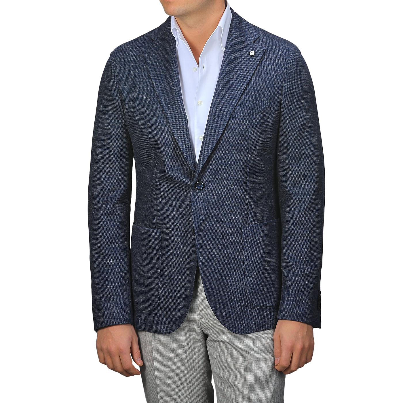 A person dons an L.B.M. 1911 Dark Blue Linen Cotton Jersey Blazer over a white shirt and gray pants, with no visible face.