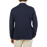 The back view of a man wearing an L.B.M. 1911 Dark Blue Washed Wool Cashmere Blazer.