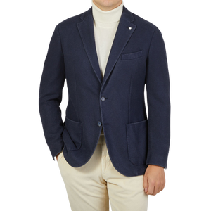 A man wearing a Dark Blue Washed Wool Cashmere Blazer from L.B.M. 1911, inspired by Italian fashion trends.