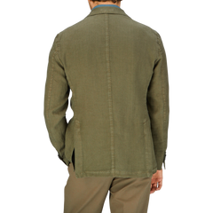 Man wearing a Grass Green Washed Linen Blazer by L.B.M. 1911 seen from the back, crafted in Italy.