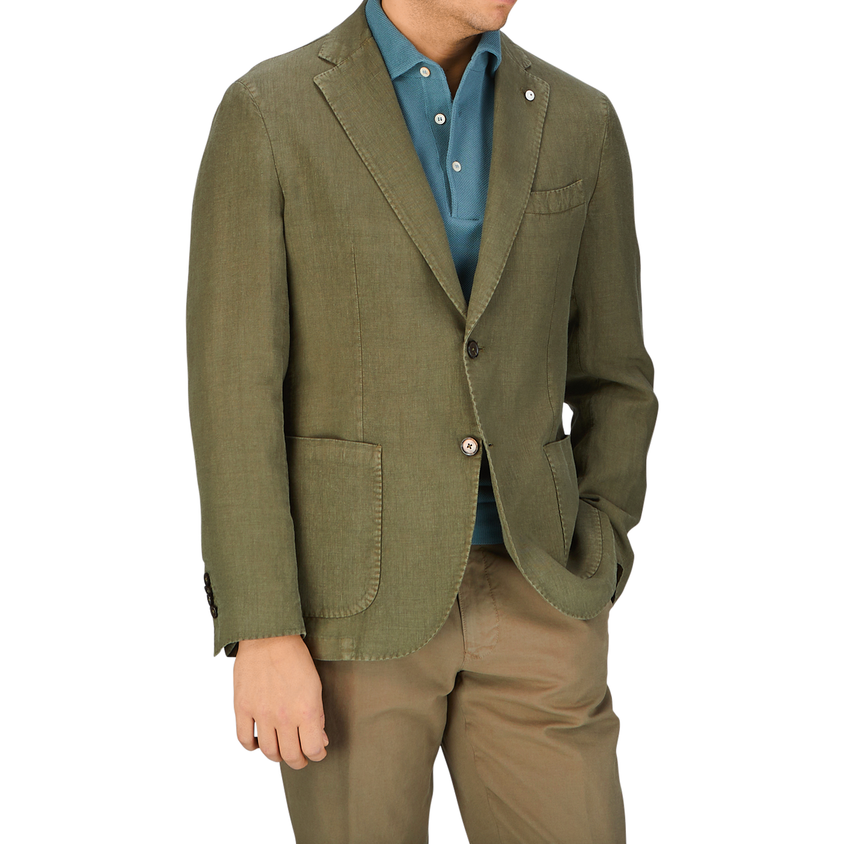 Man wearing a Grass Green Washed Linen Blazer from L.B.M. 1911, blue shirt, and beige pants from Italy.