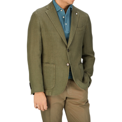 Man wearing a Grass Green Washed Linen Blazer from L.B.M. 1911, blue shirt, and beige pants from Italy.