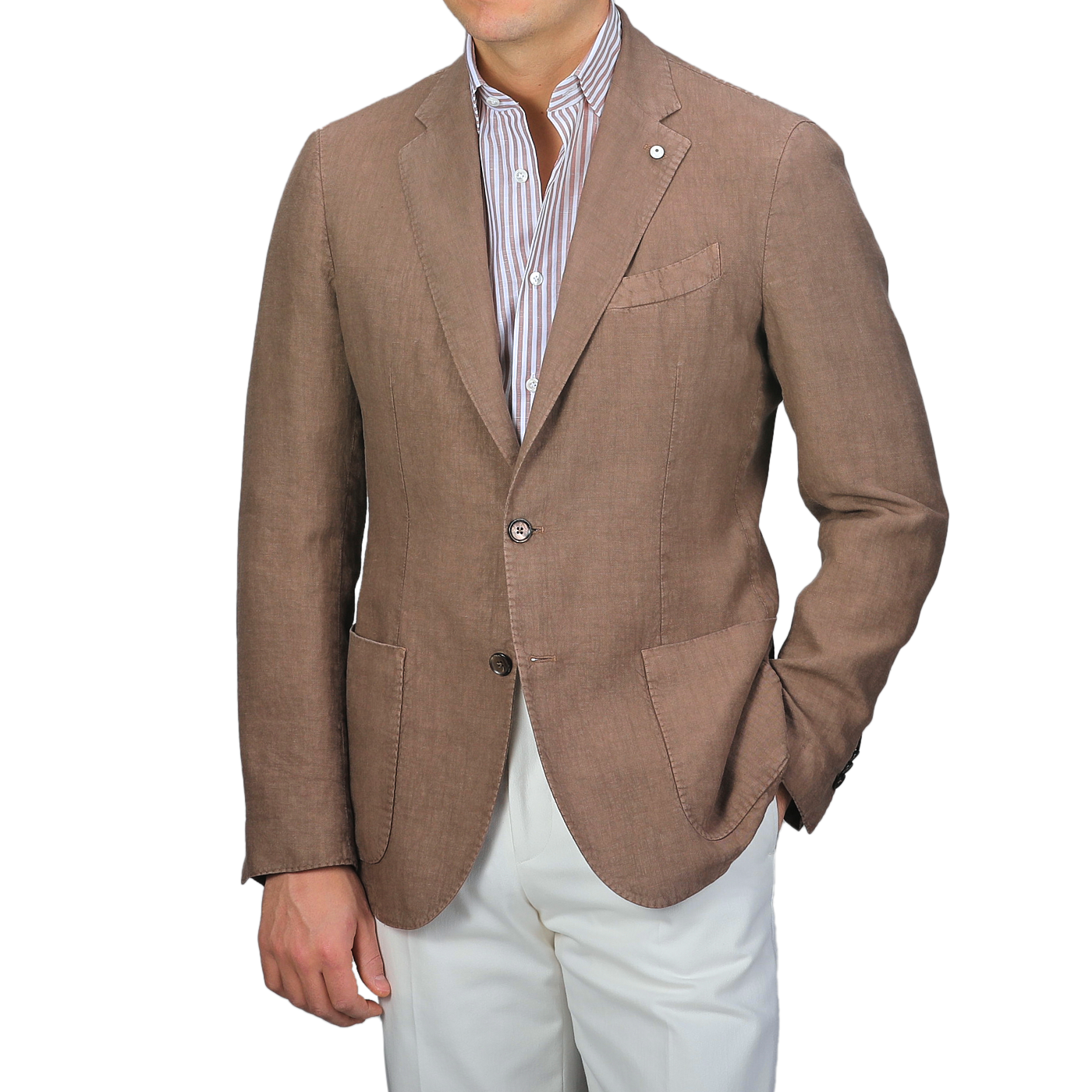 Wearing a slim fit Light Brown Washed Linen Blazer by L.B.M. 1911, alongside a striped shirt and white pants, the person poses with one hand in their pocket.