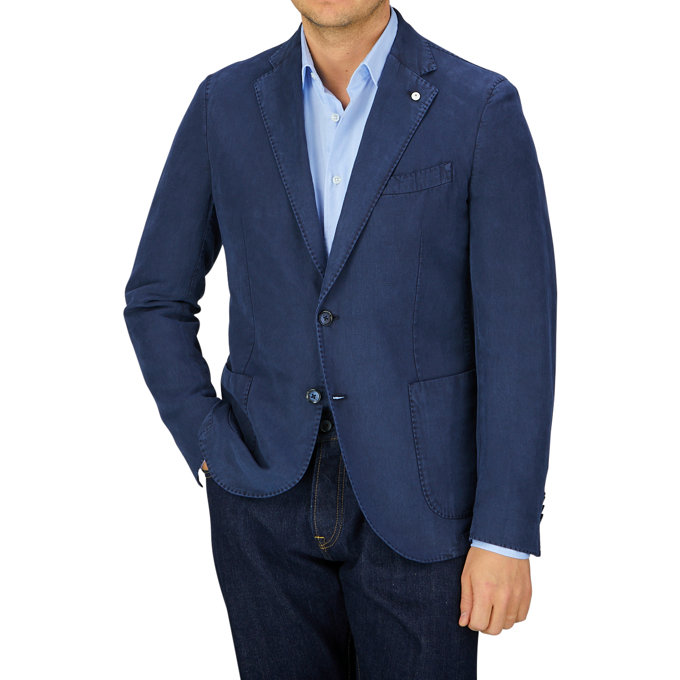 Man in a L.B.M. 1911 Navy Blue Washed Cotton Linen Blazer and shirt standing against a grey background.