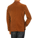 A person wearing an L.B.M. 1911 Cinnamon Brown Cotton Corduroy Blazer with blue jeans is shown from the back.