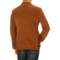 A person wearing an L.B.M. 1911 Cinnamon Brown Cotton Corduroy Blazer with blue jeans is shown from the back.