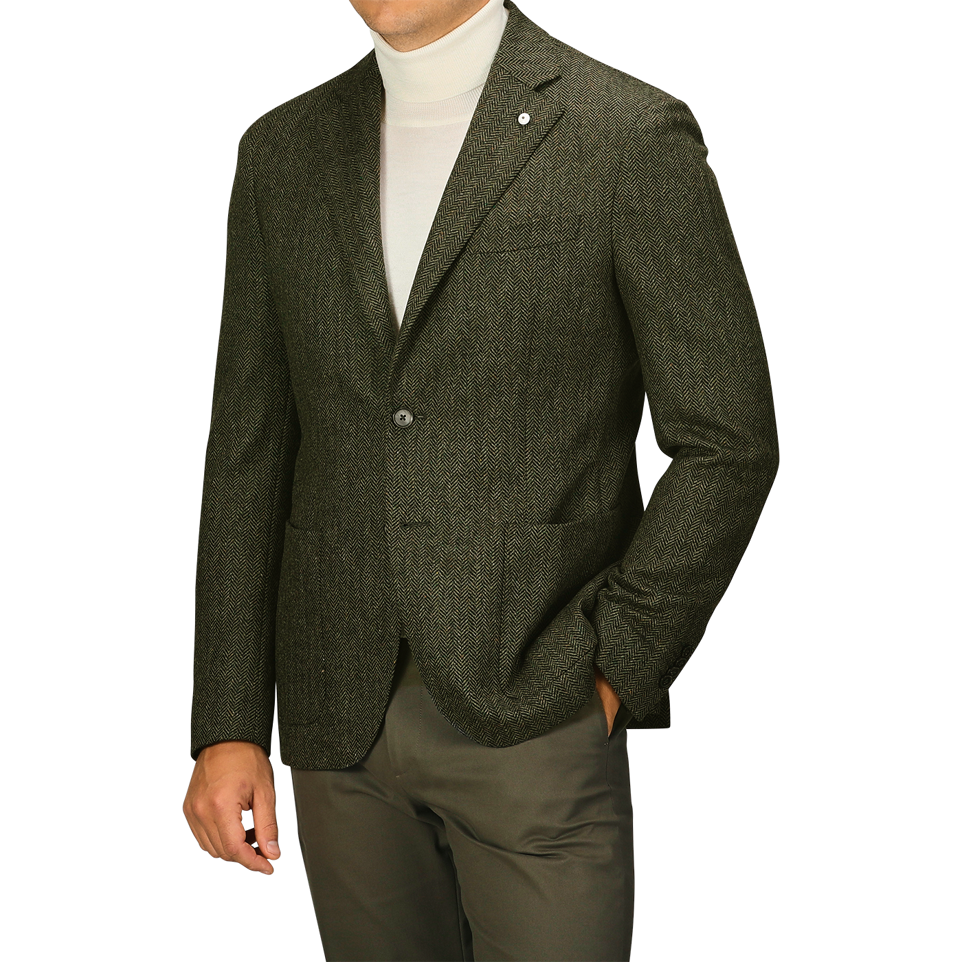 Man wearing an L.B.M. 1911 Dark Green Wool Cashmere Herringbone Blazer over a white turtleneck sweater, paired with matching dark green slim fit pants, standing with his left hand in his pocket. His face is not visible.