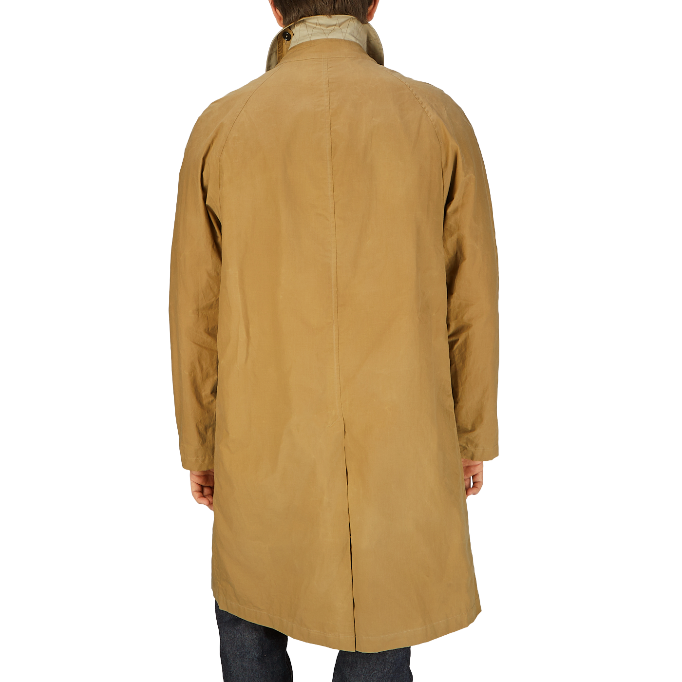 The back view of a man wearing a Dark Beige Waxed Cotton Kamikaze Trenchcoat by L'Impermeabile.