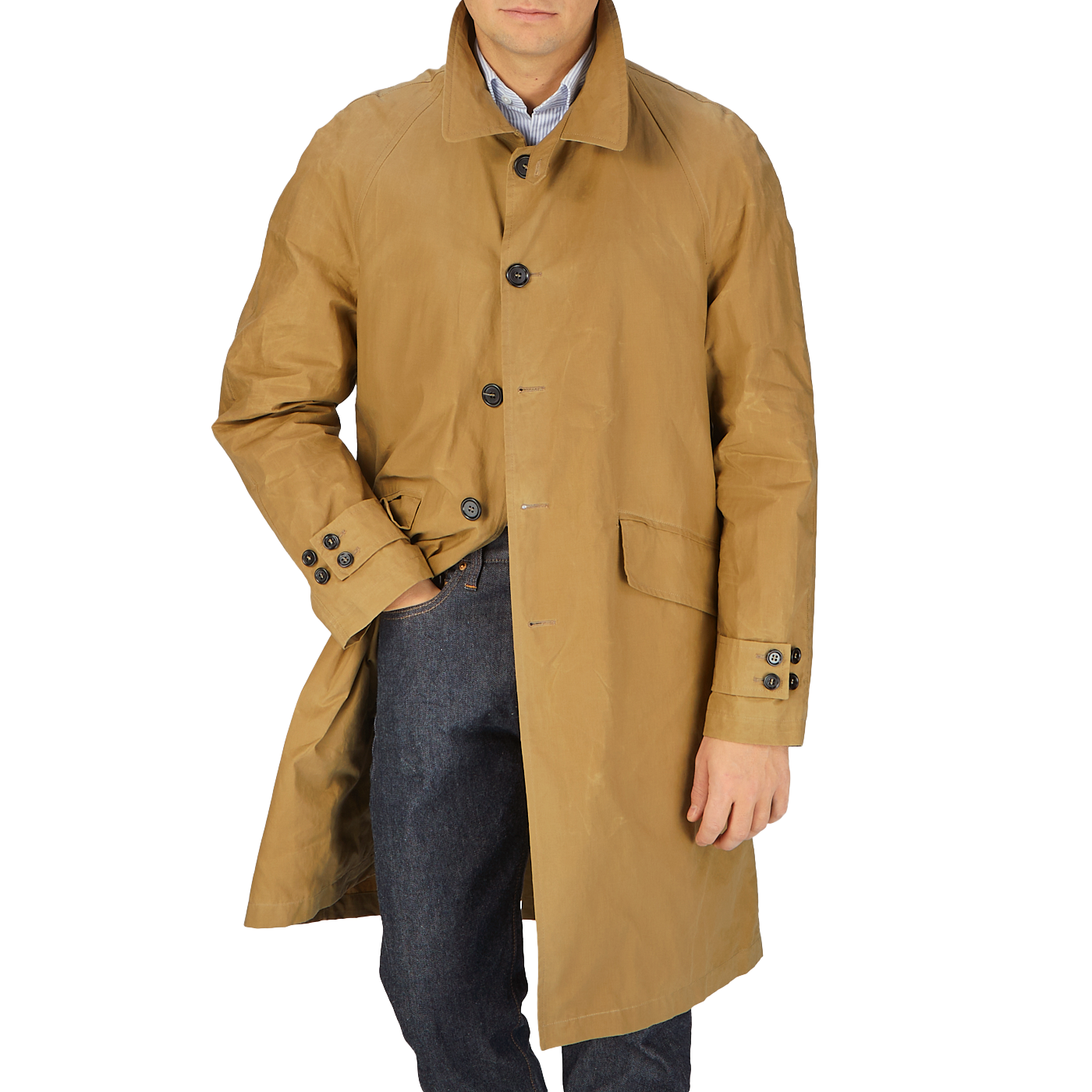 A man wearing a Dark Beige Waxed Cotton Kamikaze Trenchcoat by L'Impermeabile.