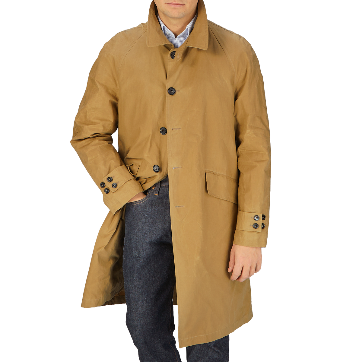 A man wearing a Dark Beige Waxed Cotton Kamikaze Trenchcoat by L'Impermeabile.