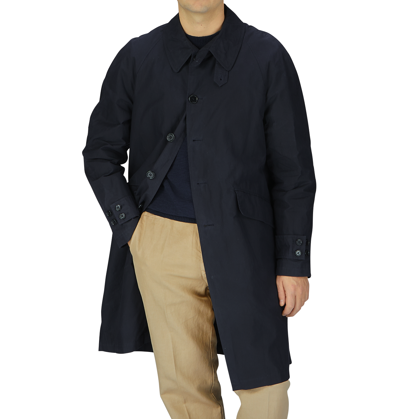 A man wearing a Navy Blue Waxed Cotton Kamikaze Trenchcoat and tan pants by L'Impermeabile.