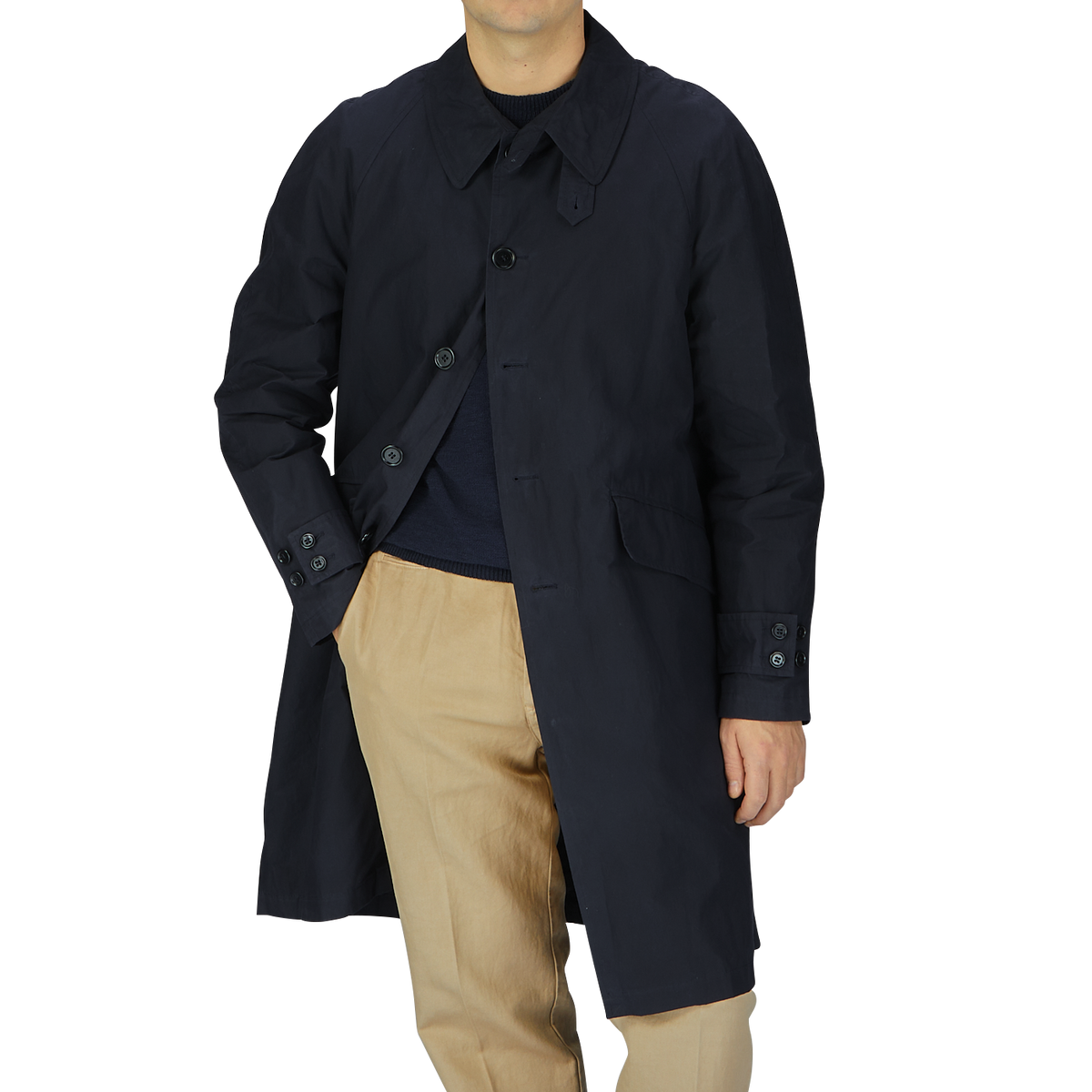 A man wearing a Navy Blue Waxed Cotton Kamikaze Trenchcoat and tan pants by L'Impermeabile.