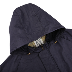 Navy Blue Waxed Cotton Bob Short Parka by L'Impermeabile, featuring a dark hood, checkered lining, and an inner collar label.