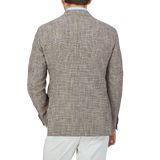 The back view of a man wearing a Luigi Bianchi Brown Checked Wool Cotton Linen Blazer.
