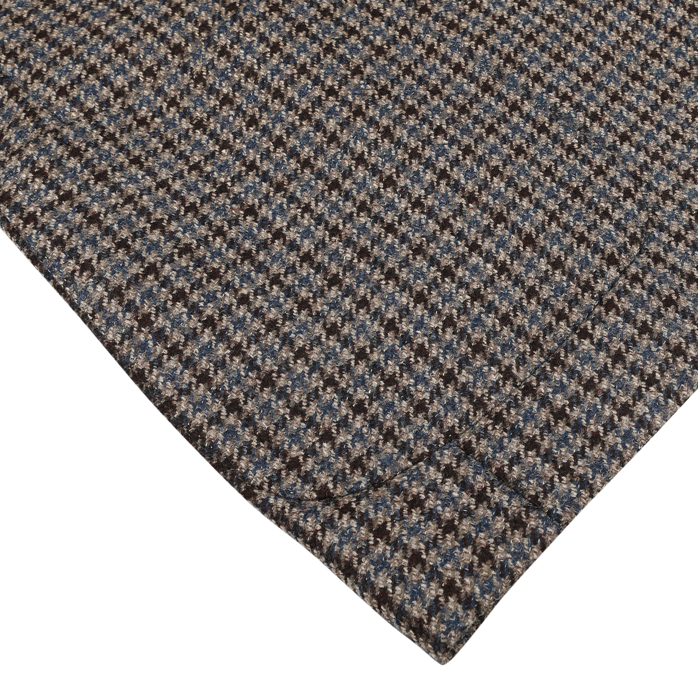 Close-up of a piece of houndstooth-patterned fabric in brown, blue, and white tones on a light surface, showcasing its detailed texture and weave—perfect for crafting the Luigi Bianchi Brown Houndstooth Wool Cashmere Hybrid Blazer.