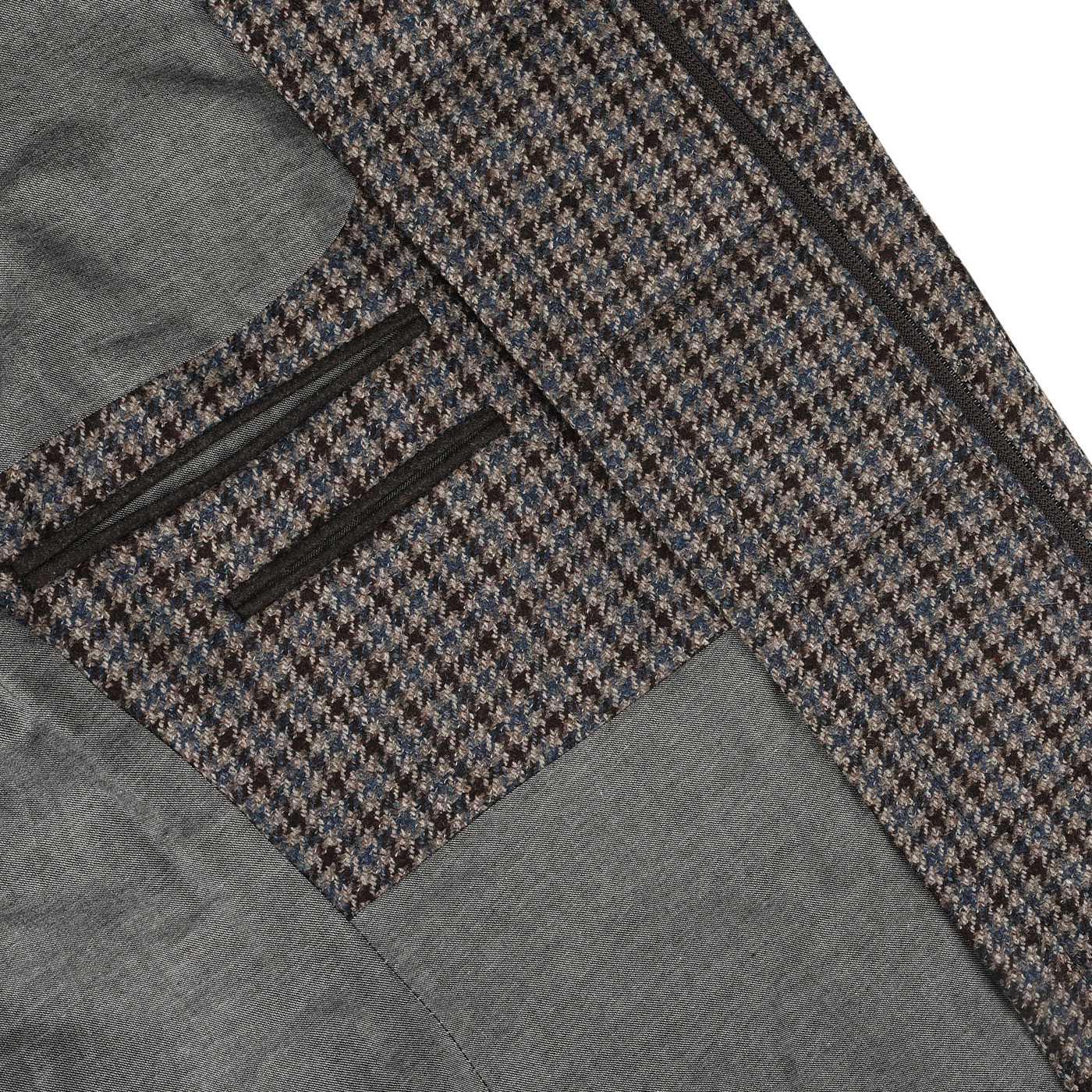 Close-up of a well-tailored Luigi Bianchi Brown Houndstooth Wool Cashmere Hybrid Blazer interior, showcasing pure virgin wool houndstooth fabric, grey lining, and multiple pockets.